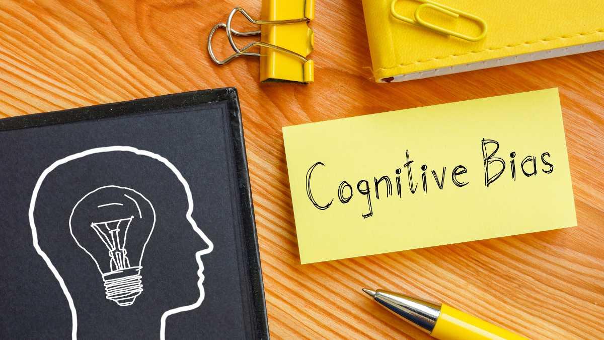 Notebook with head silhouette and Cognitive Bias note