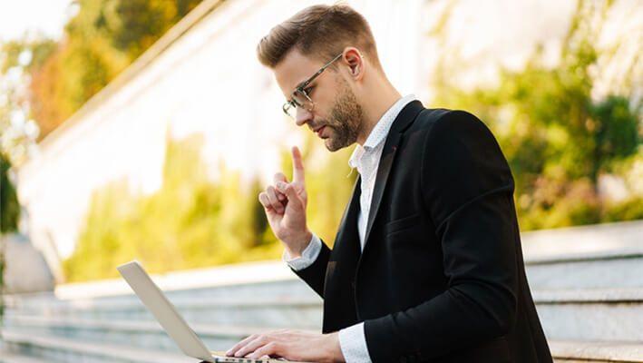 trader choosing the best ETFs on his laptop