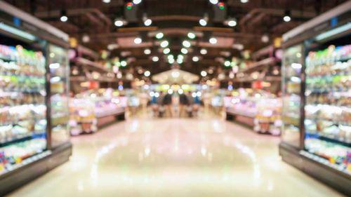 Blurred supermarket aisle view